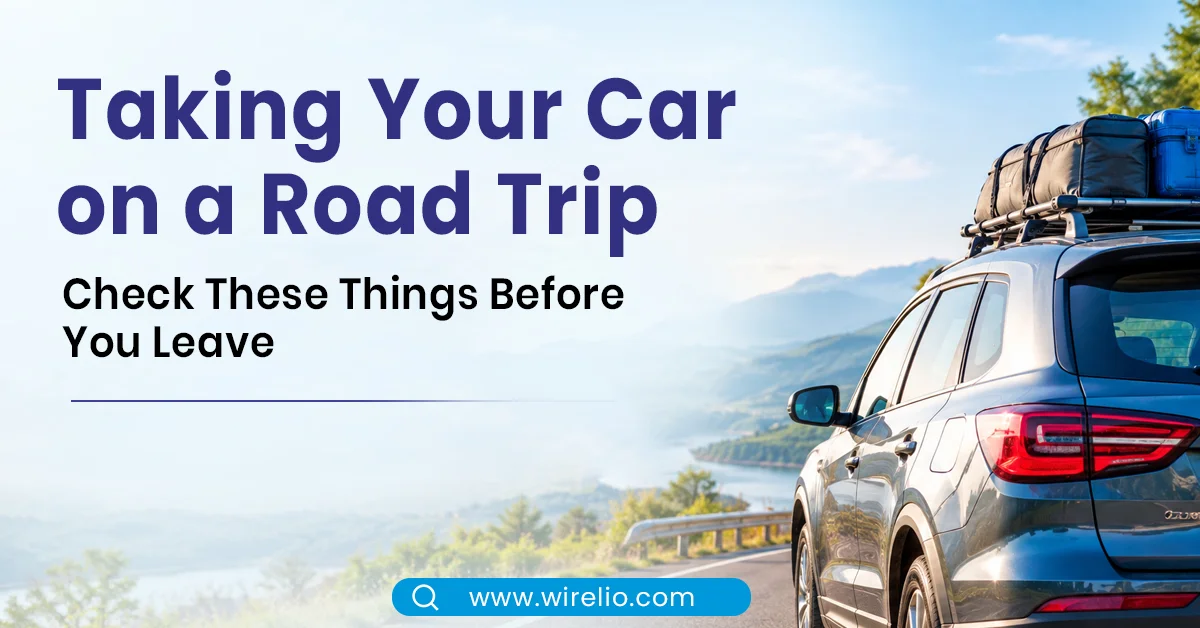 Car parked on a scenic highway during a road trip with luggage packed for holiday travel